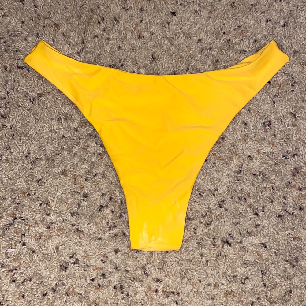 Yellow bikini bottom.